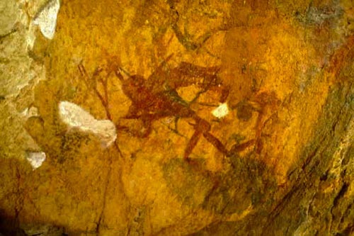 rock painting of people with weapons